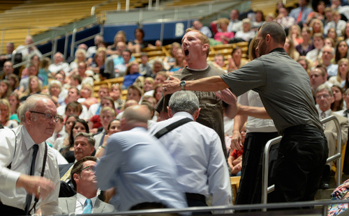 Francisco Kjolseth  |  The Salt Lake Tribune
Former First Lady Laura Bush is temporarily interrupted by an individual protesting the practices of former president George W. Bush before being forcibly removed during her keynote address at the Provo Freedom Festival's Patriotic Service at the Marriott Center on the BYU campus on Sunday, June 29, 2014.