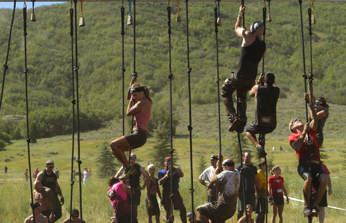 Rick Egan  |  The Salt Lake Tribune

Competitors must ring the bell at the top of the rope, in the 2014 Salt Lake City Spartan Beast race, at Soldier Hollow, Saturday, June 28, 2014.  Spartan Beast Competitors face 29 obstacle's in the 12 mile run.