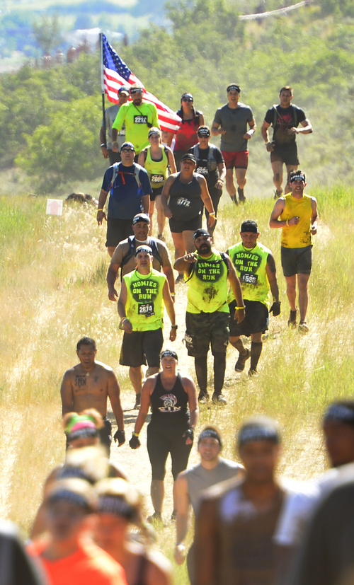 Rick Egan  |  The Salt Lake Tribune

Runners make their way through the hills, in the 2014 Salt Lake City Spartan Beast race, at Soldier Hollow, Saturday, June 28, 2014.  Spartan Beast Competitors face 29 obstacle's in the 12 mile run.