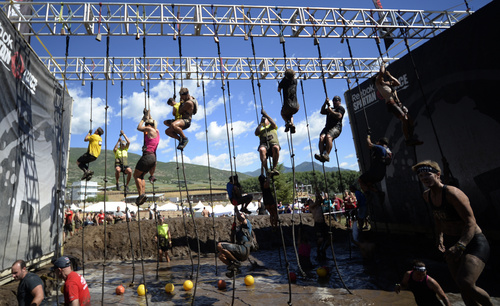 Rick Egan  |  The Salt Lake Tribune
Competitors must ring the bell at the top of the rope, in the 2014 Salt Lake City Spartan Beast race, at Soldier Hollow, Saturday, June 28, 2014.  Spartan Beast Competitors face 29 obstacle's in the 12 mile run.