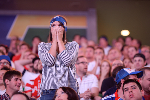 Francisco Kjolseth  |  The Salt Lake Tribune
Kristen Clifford covers her face in dismay after Germany scores on the U.S. as an estimated 4000 fans crowd into Energy Solutions Arena for some World Cup action on the 42 by 24 feet long twin high definition screens to cheer on team U.S.A. against Germany on Thursday, June 26, 2014.