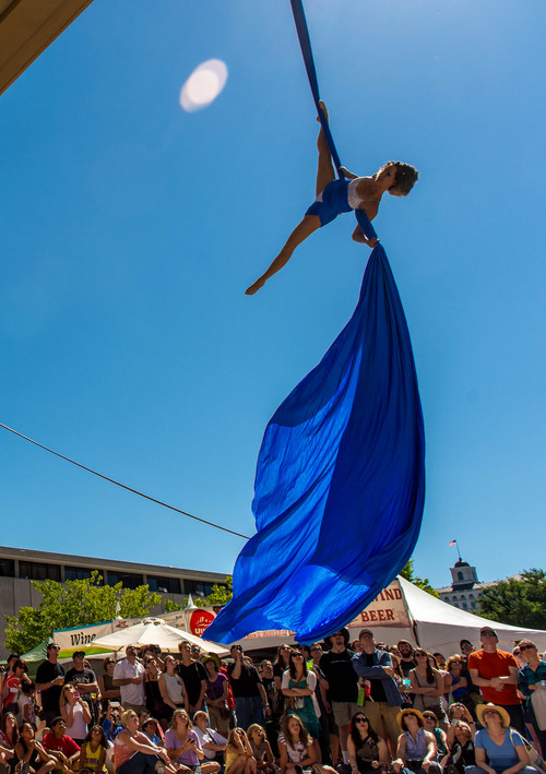 Trent Nelson  |  The Salt Lake Tribune
Rebecca Cleveland of Aerial Arts of Utah performs an aerial silk routine at the 2014 Utah Arts Festival in Salt Lake City, Saturday June 28, 2014. If you haven't made it down there yet and plan to, Sunday's your last chance. Admission is $12 at the gate, free for children 12 and under.