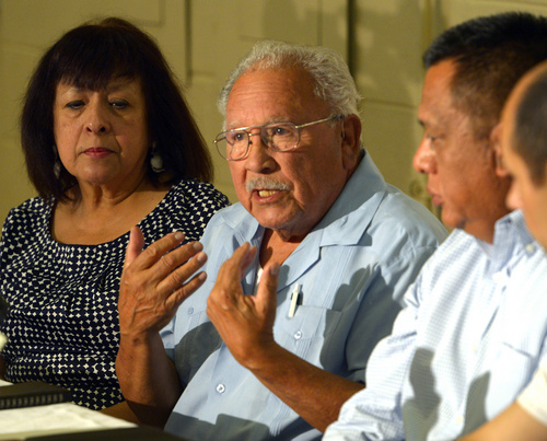 Rick Egan  |  The Salt Lake Tribune

Left to right - Brandy Farmer listens as Archie Archuleta, talk about President Obama's statement on immigration, at a press conference at the Centro Civico Mexicano, Monday, June 30, 2014. Tony Yapias and Mark Alvarez are on are the right.