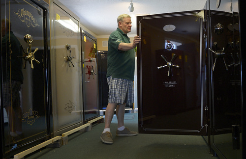 Leah Hogsten  |  The Salt Lake Tribune
Paul Hicks, owner of Utah Safe Outlet in Bountiful, shows off the various sizes and makers of safes in his showroom Tuesday, July 1, 2014. The state of Utah is offering rebates to those who buy gun safes in  part of suicide prevention efforts.