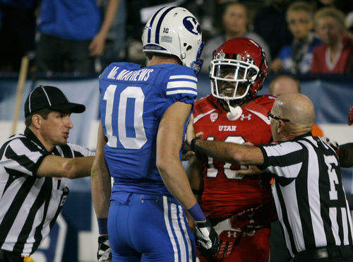 Rick Egan  | The Salt Lake Tribune 

The refs rush into break up a scuffle between Brigham Young Cougars wide receiver Mitch Mathews (10) and Utah Utes wide receiver Delshawn McClellon (10) on the last play of the first half,  as BYU faced The University of Utah, at Lavell Edwards Stadium, Saturday, September 21, 2013.