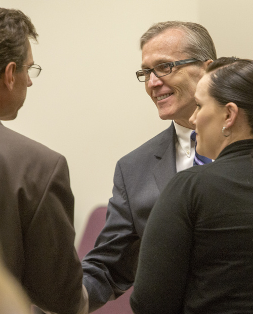 Rick Egan  |  The Salt Lake Tribune

Defense attorney, Randy Spencer shakes hands with Martin MacNeill during a break in MacNeill's forcible sexual abuse trial, in 4th District Judge Samuel McVey's courtroom, in Provo, Wednesday, July 2, 2014. Kara North is on the right.