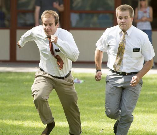 Rick Egan  |  The Salt Lake Tribune

Mormon missionaries, Elder Vincent and Elder Grover get involved in the foot races during the Hurricane Independence festivities, Friday, July 4, 2014