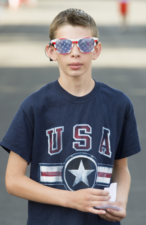 Rick Egan  |  The Salt Lake Tribune

Landon Hodge wears glasses to match his shirt, while he walks in the Hurricane Independence day Parade,  Friday, July 4, 2014