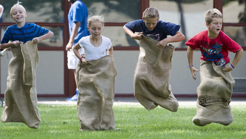 Rick Egan  |  The Salt Lake Tribune

Kids compete in the gunny sack races during the  Hurricane Independence day activities , Friday, July 4, 2014