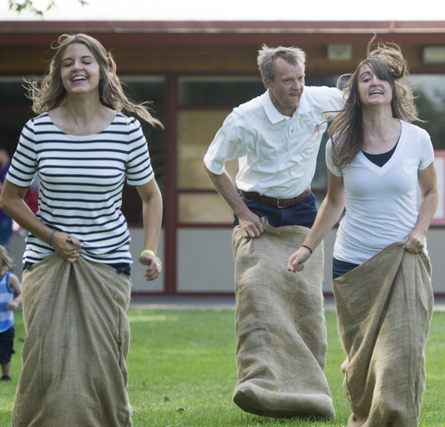 Rick Egan  |  The Salt Lake Tribune

participants compete in the adult gunny sack race during the  Hurricane Independence day activities , Friday, July 4, 2014