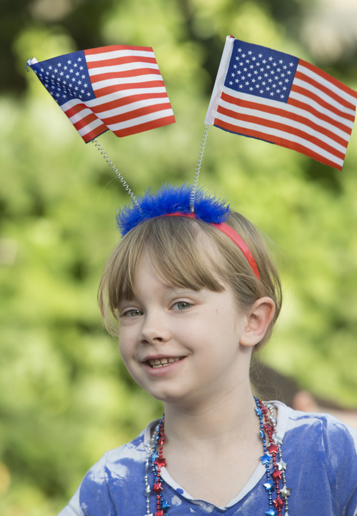 Rick Egan  |  The Salt Lake Tribune

Audrie Wallace, 7,  watches the Hurricane Independence day Parade,  Friday, July 4, 2014