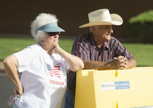 Rick Egan  |  The Salt Lake Tribune

LaVerkin residents, Lenore and Arthur George, watch the Hurricane Independence day Parade,  Friday, July 4, 2014