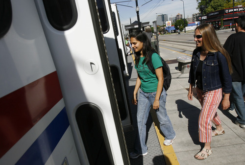 Francisco Kjolseth  | Tribune file photo
University of Utah students and employees board the red line train that connects the University of Utah to the rest of the light-rail network. A new U. study says the rail has decreased traffic in the 400/500 South corridor even as the area has grown through development.
