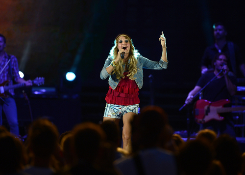Scott Sommerdorf   |  The Salt Lake Tribune
Carrie Underwood performs at the "Stadium of Fire" in Provo, Friday, July 4, 2014.