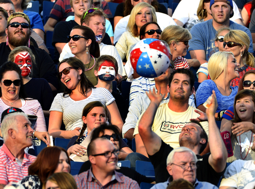 Scott Sommerdorf   |  The Salt Lake Tribune
Audience members - some with face paint - play around with a beach ball while waiting for acts to begin at the "Stadium of Fire" in Provo, Friday, July 4, 2014.