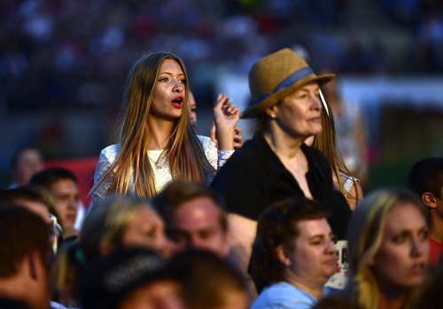 Scott Sommerdorf   |  The Salt Lake Tribune
Women in the audience sing along as Carrie Underwood performs at the "Stadium of Fire" in Provo, Friday, July 4, 2014.