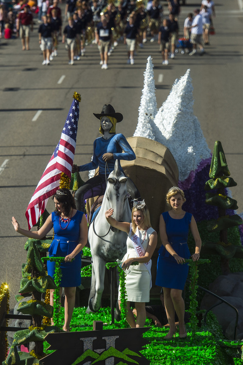 Chris Detrick  |  The Salt Lake Tribune
Miss Herriman Alexis Callister, 1st Attendant Aysa Johnson and 2nd Attendant Kelsey Faulkner wave to the crowd in the Murray 2014 Fun Days Parade along State Street Friday July 4, 2014.
