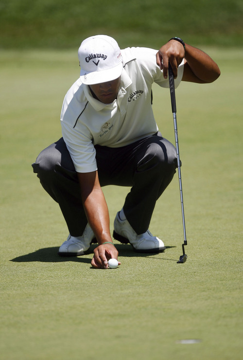 Francisco Kjolseth  |  The Salt Lake Tribune
Tony Finau of Lehi, UT, places his ball on the hole 7 green on Friday July, 29, 2011, during round two of the Nationwide Tour golf tournament at Willow Creek Country Club in Sandy.