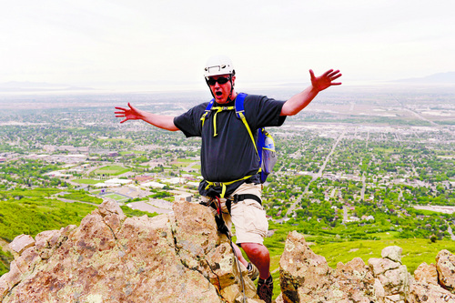 Al Hartmann  |  The Salt Lake Tribune
Kevin Sweet celebrates after completing Route 2 at the via ferrata climbing area in Waterfall Canyon near Ogden.  Via Ferrata (Italian for "iron road") is a mountain-climbing method that lets less experienced climbers enjoy the adrenaline rush and spectacular scenery usually reserved for elite climbers.  Climbers are attached with a two carbiners on short leashes to a steel cable that follows the climbing route. Climers are alaway protected with at least one carabiner and leash attached to to the cable and If one should fall it would be a short drop to the next anchor point below.  No ropes are involved. Conceived during World War I, via ferrata allowed Italian soldiers from the flatlands to move quickly through the mountains as they fought the Austrians for higher ground.