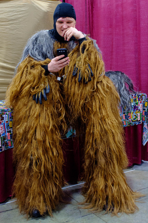 Trent Nelson  |  The Salt Lake Tribune
Dartanian Richards, dressed as Chewbacca, takes a break to check his messages at FantasyCon, held at the Salt Palace Convention Center in Salt Lake City on Saturday.