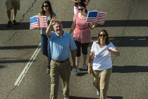 Chris Detrick  |  The Salt Lake Tribune
Congressman Jim Matheson participates in the Murray 2014 Fun Days Parade along State Street Friday July 4, 2014.