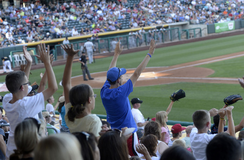 Al Hartmann  |  The Salt Lake Tribune 
Fans cheer from the the stands during Bees-Tacoma game Monday July 7.