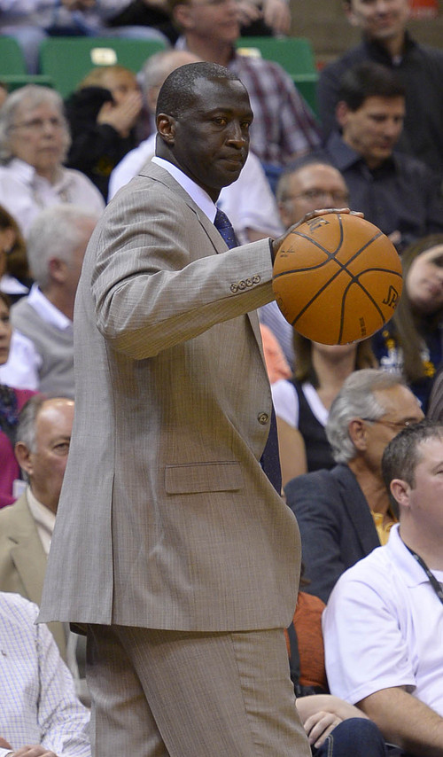 Leah Hogsten  |  The Salt Lake Tribune
Utah Jazz head coach Tyrone Corbin rebounds a ball that bounced off the hand of Utah Jazz center Derrick Favors (15). The Utah Jazz are behind the New Orleans Pelicans 45-43 at the half of their game Friday, April 4, 2014 at Energy Solutions Arena.