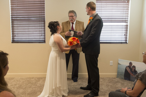 Rick Egan  |  The Salt Lake Tribune
Tribune columnist, Robert Kirby performs a wedding for Jerri Lynn Moore  and Zachary Peter Hans at their home in Herriman on Monday, July 7, 2014.