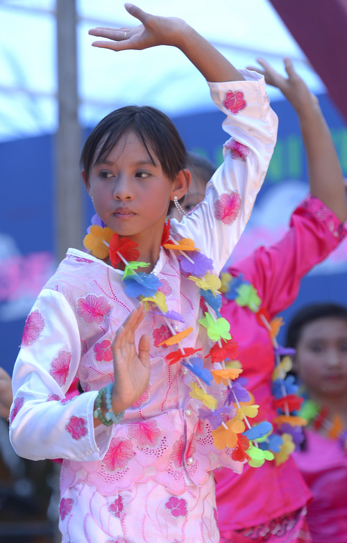 Leah Hogsten  |  The Salt Lake Tribune
Su San, 13, performs one of ten traditional Burmese dances at the 6th annual Burmese Water Festival, Saturday, July 5, 2014, a celebration of the Burmese New Year, traditionally held in April. The Burmese community gathers money from its members for free dance performances, food and fun.