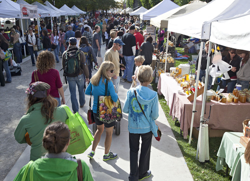 Lennie Mahler  |  Tribune file photo
Shoppers stroll through the Downtown Farmers Market. This year's market kicks off Saturday at Pioneer Park.