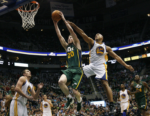 Scott Sommerdorf  |  The Salt Lake Tribune             
Jazz forward Gordon Hayward made this spectacular driving dunk past the Warrior's Richard jefferson during fourth quarter play to energize the team. The Utah Jazz defeated the Golden State Warriors 99-92 in OT at Energy Solutions Arena, Saturday, March 17, 2012.