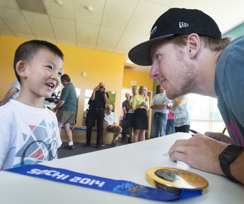 Steve Griffin  |  The Salt Lake Tribune


Four-year-old  Eric Song smiles as he gets an autograph from Olympic champion Ted Ligety during his visit to the Taylorsville YMCA Summer Day Camp in Taylorsville, Utah Monday, July 7, 2014.  This past winter the YMCA of Northern Utah partnered with the U.S. Ski and Snowboard Association, National Winter Sports Education, Ted Ligety and Park City Mountain Resort to give youth in the YMCA programs a chance to learn how to ski.