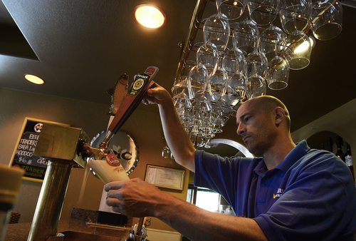 Scott Sommerdorf   |  The Salt Lake Tribune
Bill Jackson pulls a beer on tap at the small bar off the main dining room at the Honeycomb Grill at Solitude Mountain Resort.