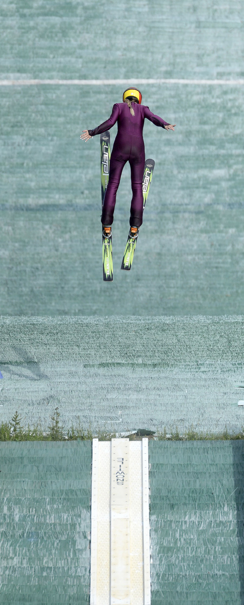 Al Hartmann  |  The Salt Lake Tribune 
Kailey Bickner, from Chicago looks for her landing coming off the 40 meter practice ski jump at Olympic Sports Park.  The U.S. Women's Ski Team is seeing a surge of interest from young girls wanting to take up the sport following its debut at the Sochi Olympics.