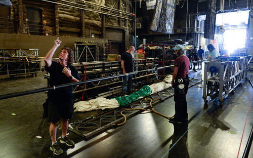 Francisco Kjolseth  |  The Salt Lake Tribune
The Broadway touring show of "Wicked" gets loaded in at the Capitol Theatre for a 6 1/2-week run as crews pull gear and backdrops into the rafters.