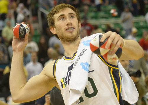 Rick Egan  |  The Salt Lake Tribune

Utah Jazz guard Gordon Hayward (20) tosses autographed basketballs in to the crowd, after the last home game of the season, at EnergySolutions Arena, Monday, April 14, 2014
