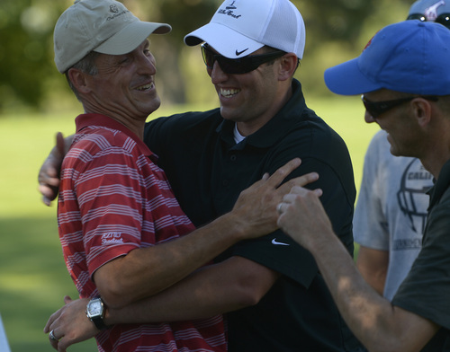 Leah Hogsten  |  The Salt Lake Tribune
Jon Wright is congratulated by family. Wright became the 116th Utah State Amateur golf tournament winner for the second time Saturday, July 11, 2014 at Ogden Golf and Country Club.