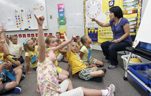 Al Hartmann  |  Tribune file photo  

The Jordan School District has seen enrollment skyrocket in its dual immersion language programs. Peichi Chang teaches first-graders  a counting excercise in the Chinese language program at Foothills Elementary in Riverton in 2012. Two sons of the state senator who wrote Utah's dual immersion language program into law are launching a foundation to spread the concept to other states.