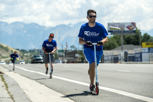 Chris Detrick  |  The Salt Lake Tribune
Razor Crusaders Collin Brian, Alec Wilson and Austin Flint ride along Beck Street Saturday July 12, 2014.  The 26 member team rode over 380 miles in relay format from St. George to Kaysville starting Thursday afternoon and ending Saturday afternoon. The "Ride for Diabetes" is raising awareness and money for diabetes research.