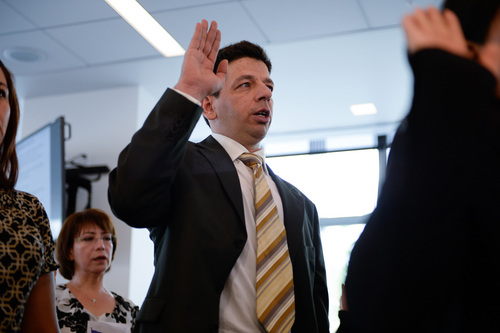 Francisco Kjolseth  |  The Salt Lake Tribune
Hussein-Jake Kadhim, who worked as a translator for the U.S. Army in his native Iraq, is sworn in as an American citizen on Friday at the new federal courthouse in Salt Lake City. Kadhim survived three murder attempts during his five years as an interpreter but stuck with the job.