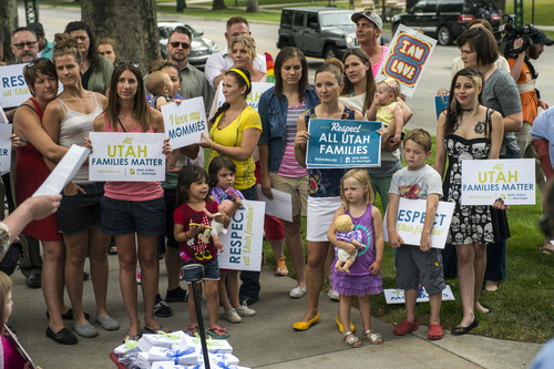 Chris Detrick  |  The Salt Lake Tribune
Members of Utah Unites for Marriage gather outside of the Governor's Mansion in Salt Lake City Wednesday July 9, 2014. Utah Unites for Marriage delivered more than 3,800 signatures collected on a petition urging Governor Gary Herbert and Attorney General Sean Reyes to end their "relentless court fight to stop same-sex marriage and deny legally married couples recognition and access to second-parent adoptions."