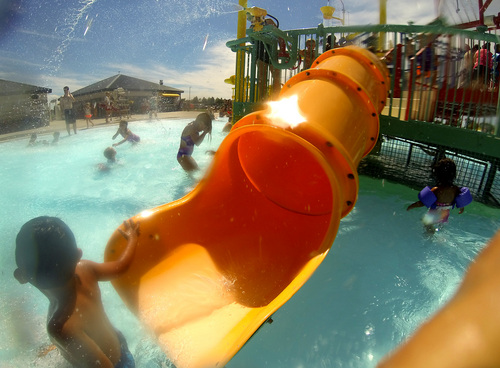 Leah Hogsten  |  The Salt Lake Tribune
Kids and their parents enjoy the cool waters of North Ogden's North Shore Aquatic Center, July 14, 2014.