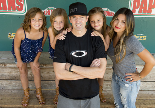 Jeremy Harmon  |  The Salt Lake Tribune

Zach Sorenson and his wife Shally Sorensen pose for a family picture along with their daughters at Smith's Ballpark in Salt Lake City on Saturday, July 5, 2014. The girls are (l-r) Braylen, 8, Cambry, 7, and Serae, 8.