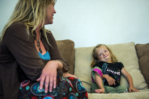 Chris Detrick  |  The Salt Lake Tribune
Alexis Watson, 12, and her mom Angie at their home in Salt Lake City Thursday July 10, 2014. Alexis has a chromosome abnormality called 4p-, 11p trisomy. Watson feels Alexis has the intellectual ability and the desire to attend a typical, first-grade classroom. But she says education officials have told her Alexis would be placed with typical kids of her same age, citing studies showing students with disabilities do better when grouped with peers. Watson feels this type of placement would be inappropriate for Alexis, who is the physical size of a first-grader. She is asking school districts statewide to consider allowing Alexis to attend a first-grade classroom this fall.