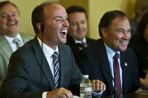 Chris Detrick  |  The Salt Lake Tribune
Utah Governor Gary R. Herbert and Rep. Spencer Cox laugh during the confirmation hearing for Lieutenant Governor nominee Rep. Spencer Cox at the Utah State Capitol Tuesday October 15, 2013.
