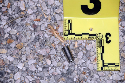 (Investigation photos)

An empty shell casing is seen on the road outside Matthew David Stewart's house in Ogden following a shootout with police on January 4, 2012.