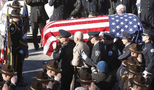 Leah Hogsten | Tribune file photo  
Members of the Ogden Police Department carry the casket of Ogden police Officer Jared Francom. Joined by law enforcement officers statewide, the family and friends of slain Ogden police Officer Jared Francom said farewell during Wednesday, January 11, 2012 funeral services at Weber State University's Dee Events Center. Francom, the 30-year-old father of two young girls, was gunned down during a drug raid on an Ogden home the night of Jan. 4. Five other officers also were wounded in a hail of gunfire that erupted as the Weber-Morgan Narcotics Strike Force attempted to serve a "knock and announce" search warrant on the residence of Matthew David Stewart.