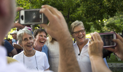 Steve Griffin  |  The Salt Lake Tribune


Plaintiffs Kody Partridge, second from left, and Laurie Wood, right, stand for photographs as they join Utah Unites for Marriage at City Creek Park in Salt Lake City, Utah Wednesday, June 25, 2014, to celebrate the historic decision in Kitchen v. Herbert and stepping-stone toward the freedom to marry.