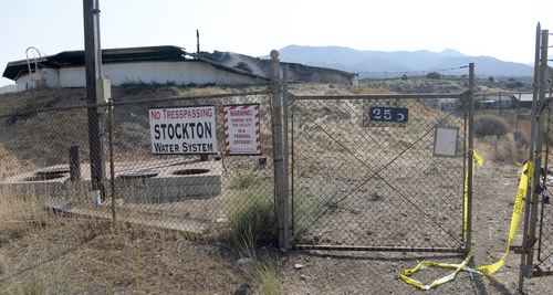 Al Hartmann  |  The Salt Lake Tribune 
Stockton water tank roof was burned in the 179 acre fire yesterday Wednesday July 16 necessitating a no use water rule for part of town.