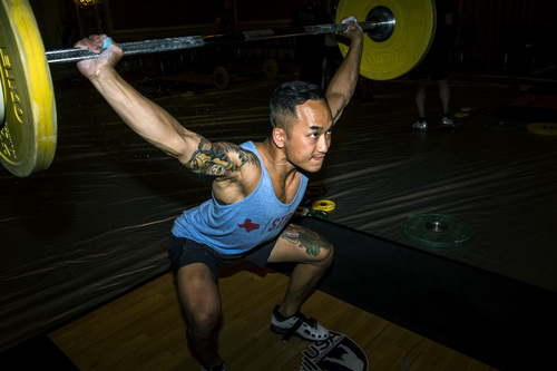 Chris Detrick  |  The Salt Lake Tribune
Dustin Ma, of Sandy, practices the snatch before competing in the USA Weightlifting National Championships at The Grand America Hotel Thursday July 17, 2014.